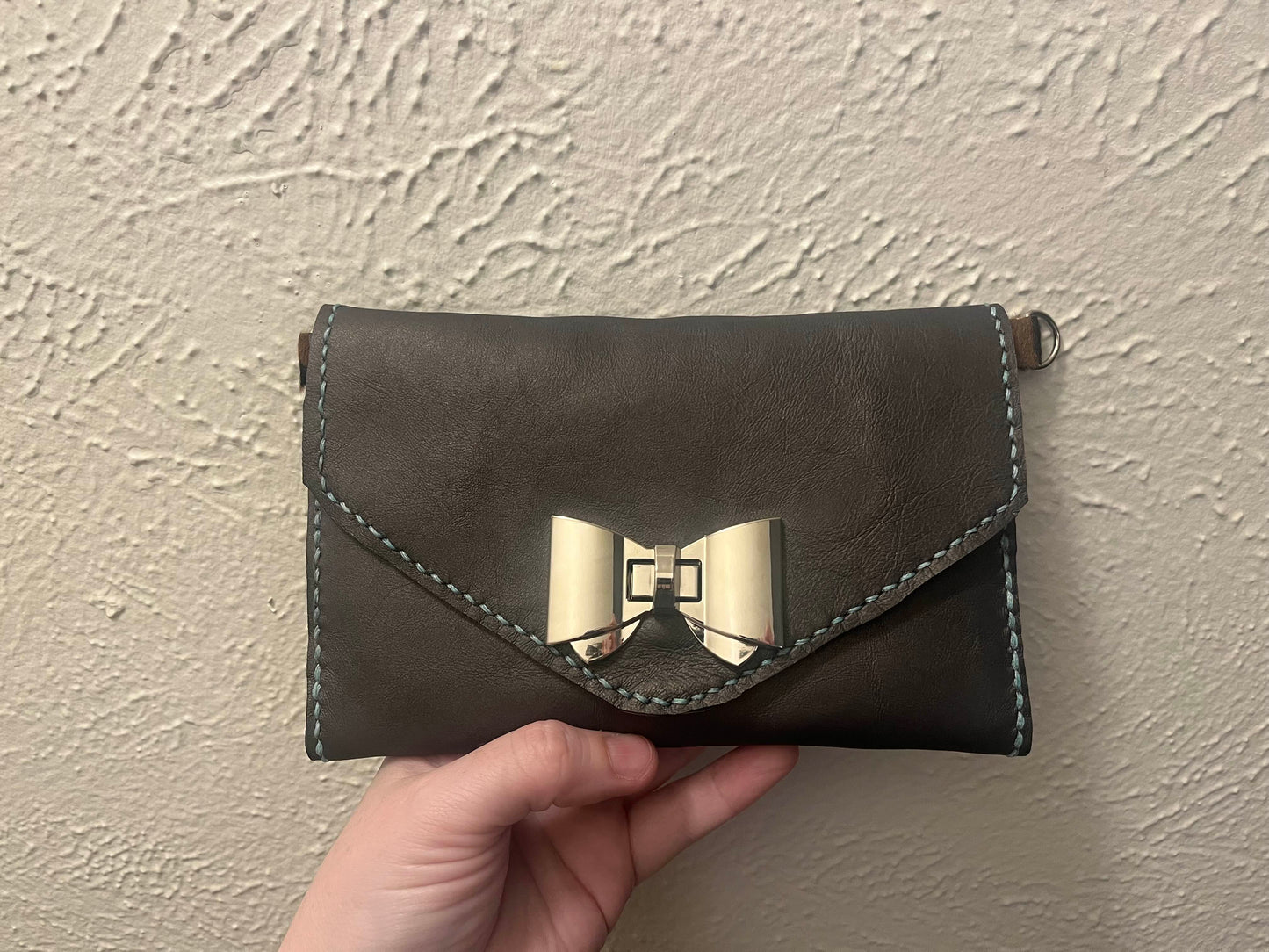 The Bow and Claw Clutch